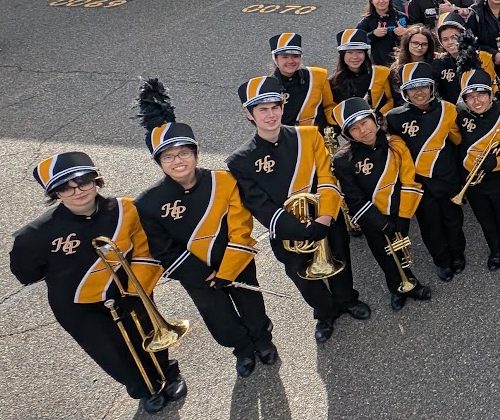 Trombone and trumpet players in uniform