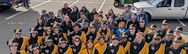 Band parents and families standing behind the students